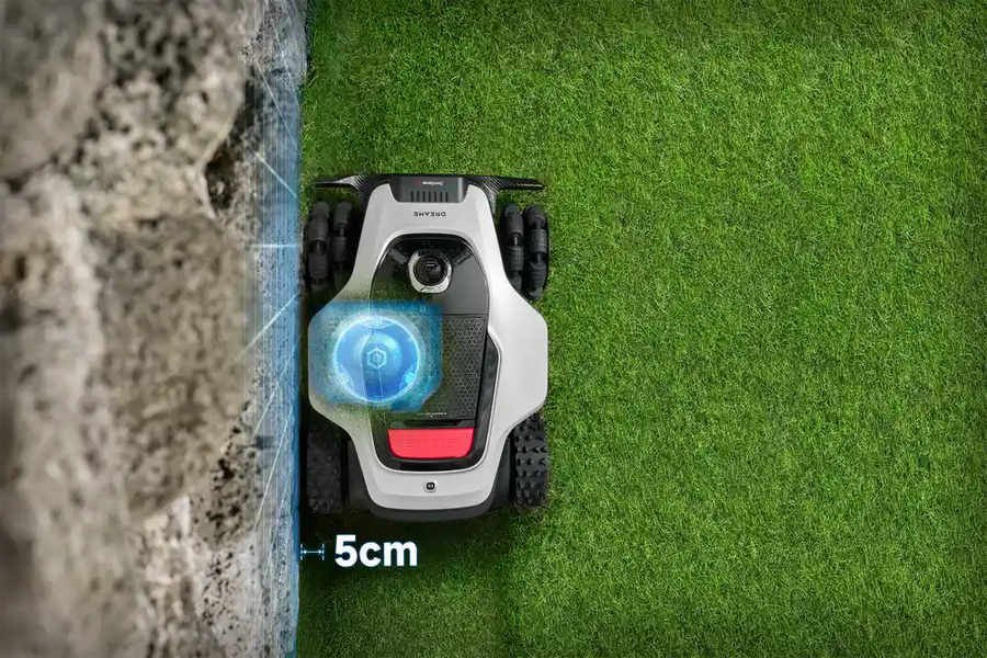 Dreame robot lawn mower sensing a stone wall edge with a 5cm precision distance marker.